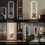Miroir sur pied à LED irrégulier